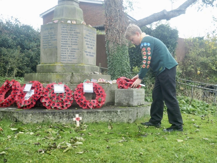 Cub laying wreath at war memorial